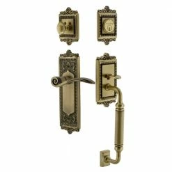 Nostalgic Warehouse Egg and Dart Plate 2-3/8 in. Backset C Grip Antique Brass Entry Set Swan Door Handle