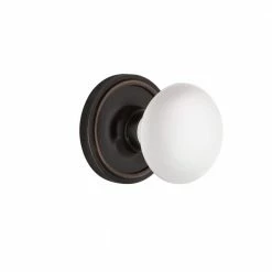 Nostalgic Warehouse Classic Rosette 2-3/4 in. Backset Timeless Bronze Passage Hall/Closet White Porcelain Door Knob