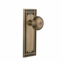 Nostalgic Warehouse Mission Plate 2-3/4 in. Backset Antique Brass Passage Hall/Closet New York Door Knob