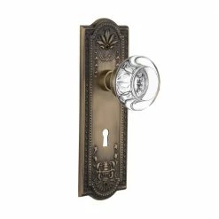 Nostalgic Warehouse Meadows Plate with Keyhole 2-3/4 in. Backset Antique Brass Passage Hall/Closet Round Clear Crystal Glass Door Knob