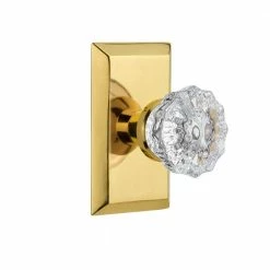 Nostalgic Warehouse Studio Plate 2-3/8 in. Backset Polished Brass Passage Hall/Closet Crystal Glass Door Knob