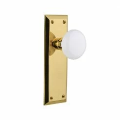 Nostalgic Warehouse New York Plate 2-3/8 in. Backset Unlacquered Brass Passage Hall/Closet White Porcelain Door Knob