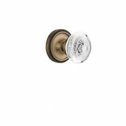 Nostalgic Warehouse Classic Rosette 2-3/8 in. Backset Antique Brass Passage Hall/Closet Crystal Egg and Dart Door Knob
