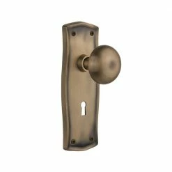 Nostalgic Warehouse Prairie Plate with Keyhole 2-3/8 in. Backset Antique Brass Privacy Bed/Bath New York Door Knob