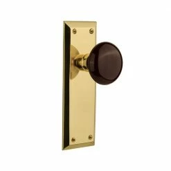 Nostalgic Warehouse New York Plate 2-3/8 in. Backset Polished Brass Privacy Bed/Bath Brown Porcelain Door Knob