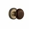 Nostalgic Warehouse Classic Rosette 2-3/4 in. Backset Antique Brass Privacy Bed/Bath Brown Porcelain Door Knob
