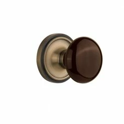 Nostalgic Warehouse Classic Rosette 2-3/4 in. Backset Antique Brass Privacy Bed/Bath Brown Porcelain Door Knob
