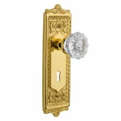 Nostalgic Warehouse Egg and Dart Plate with Keyhole 2-3/4 in. Backset Polished Brass Privacy Bed/Bath Crystal Glass Door Knob